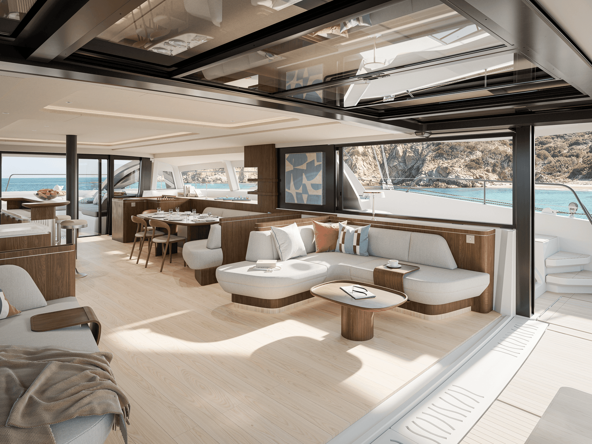 The saloon of the Bali 7.0 catamaran opening out onto the sea in a loft concept with panoramic view 